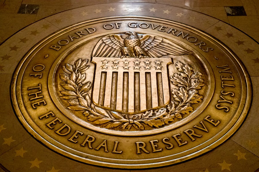 This Feb. 5, 2018, file photo shows the seal of the Board of Governors of the United States Federal Reserve System in the ground at the Marriner S. Eccles Federal Reserve Board Building in Washington. (Andrew Harnik/AP Photo)