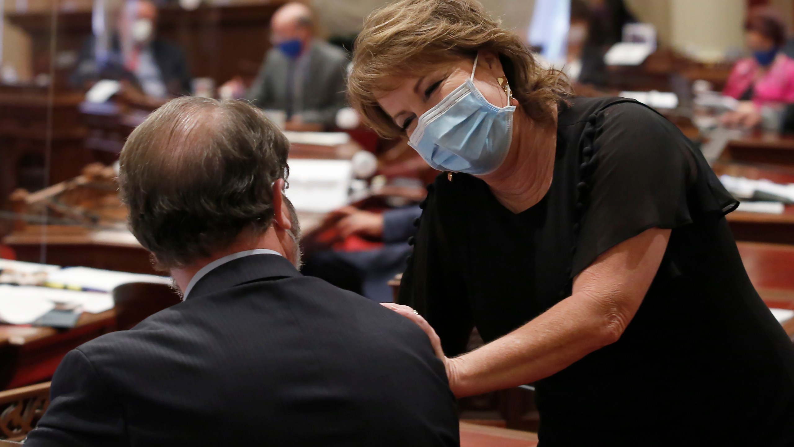 In this Thursday June 25, 2020 file photo State Senate Republican Leader Shannon Grove, of Bakersfield, talks with Sen. John Moorlach, R-Costa Mesa before at the Capitol, in Sacramento. (AP Photo/Rich Pedroncelli, File)