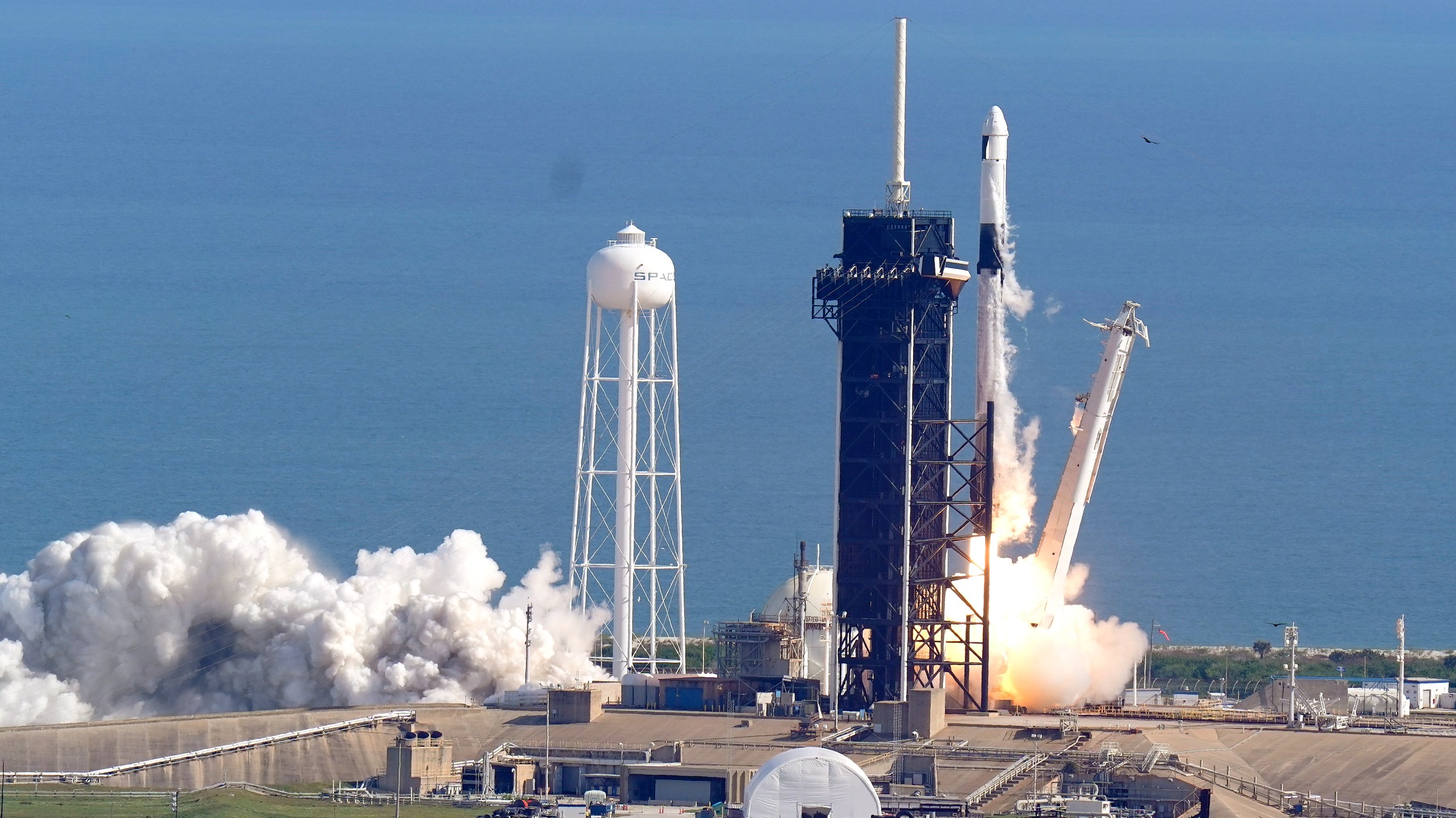 A SpaceX Falcon 9 rocket on a resupply mission to the International Space Station lifts off from pad 39A at the Kennedy Space Center in Cape Canaveral, Fla., Sunday, Dec. 6, 2020. (AP Photo/John Raoux)