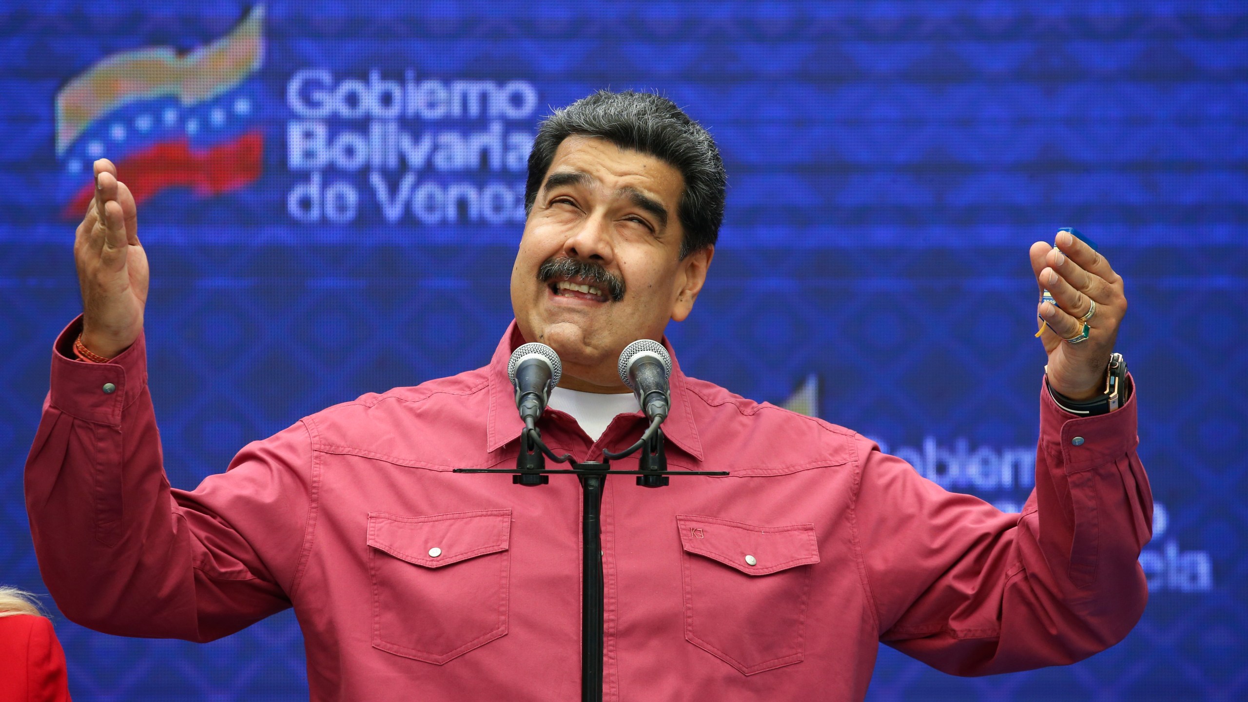 Venezuela's President Nicolas Maduro talks to journalist covering his vote in elections to choose members of the National Assembly in Caracas, Venezuela, Sunday, Dec. 6, 2020. (Ariana Cubillos/AP Photo)