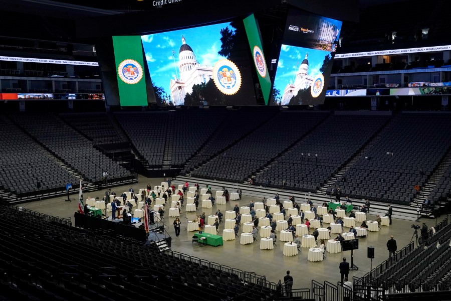 Members of the California State Assembly gathered on the floor of the Golden 1 Center for their organizational session in Sacramento, Calif., on Dec. 7, 2020. In order to follow social distancing guidelines, the Assembly session was held at the home of the Sacramento Kings. (AP Photo/Rich Pedroncelli)