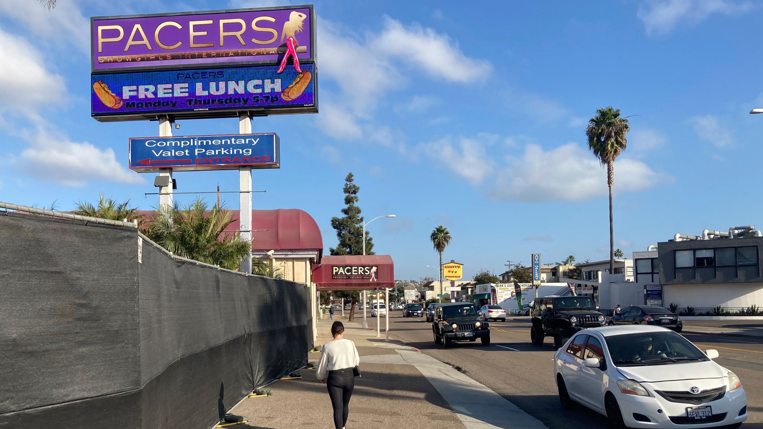 A pedestrian walks past Pacers Showgirls International in San Diego, on Thursday, Dec. 10, 2020. (Elliot Spagat/AP Photo)