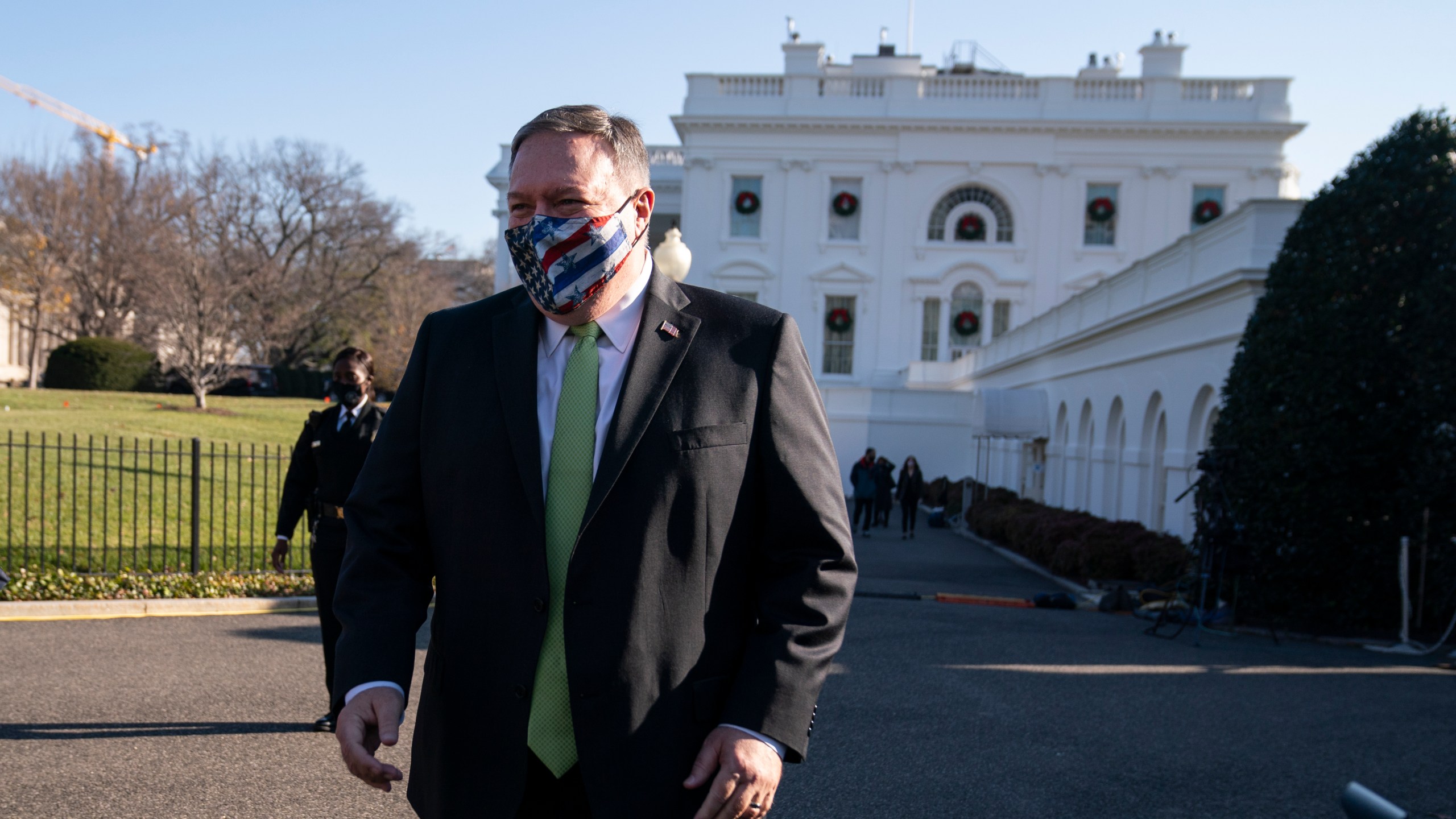 Secretary of State Mike Pompeo visits the White House with family members, Friday, Dec. 11, 2020, in Washington. (AP Photo/Evan Vucci)