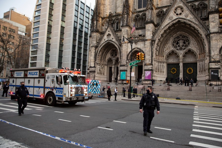 New York police officers block off the scene of a shooting at the Cathedral Church of St. John the Divine, Sunday, Dec. 13, 2020, in New York. (Ted Shaffrey/AP Photo)