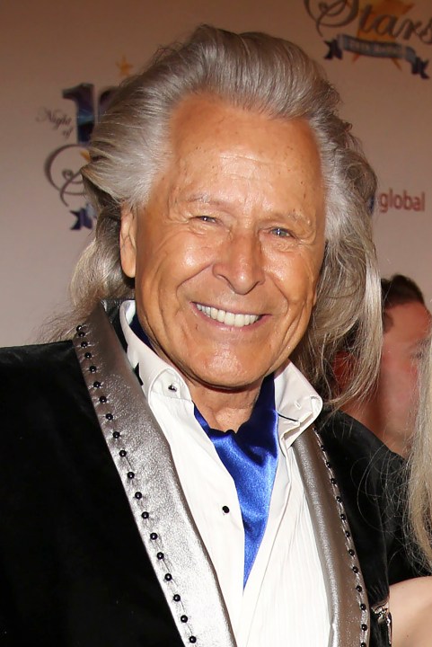 In this March 2, 2014, file photo, Peter Nygard attends the 24th Night of 100 Stars Oscars Viewing Gala at The Beverly Hills Hotel in Beverly Hills, Calif. Nygard faces criminal charges in New York after his Canadian arrest on charges alleging that he dangled opportunities in fashion and modeling to lure dozens of women and girls to have sex with himself and others. The 79-year-old Nygard awaited an appearance in a Winnipeg courtroom after his Monday, Dec. 14, 2020 arrest in Winnipeg, Manitoba, Canada by Canadian authorities at the request of the United States. (Annie I. Bang /Invision/AP, File)