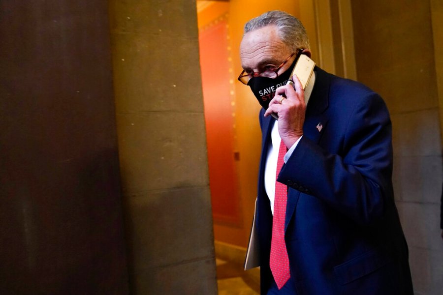 Senate Minority Leader Sen. Chuck Schumer of N.Y., walks on Capitol Hill in Washington, Tuesday, Dec. 15, 2020. (AP Photo/Susan Walsh)