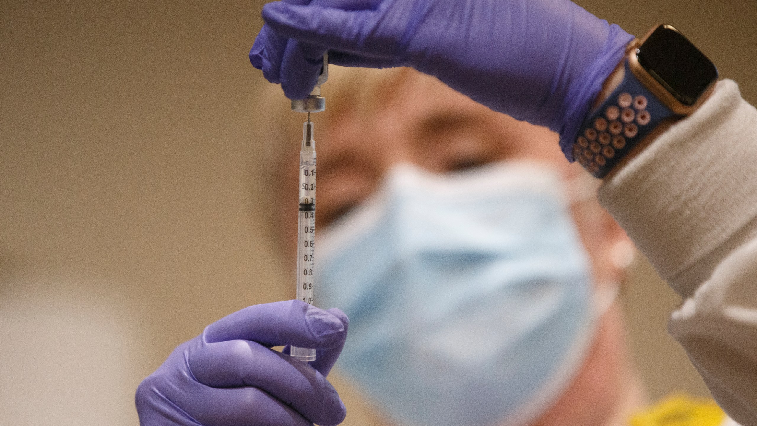 Tami Jeffries, RN, prepares the first locally available dose of the Pfizer-BioNTech COVID-19 vaccine at Mary Washington Hospital in Fredericksburg, Va., on Dec. 15, 2020. (Mike Morones/The Free Lance-Star via Associated Press)