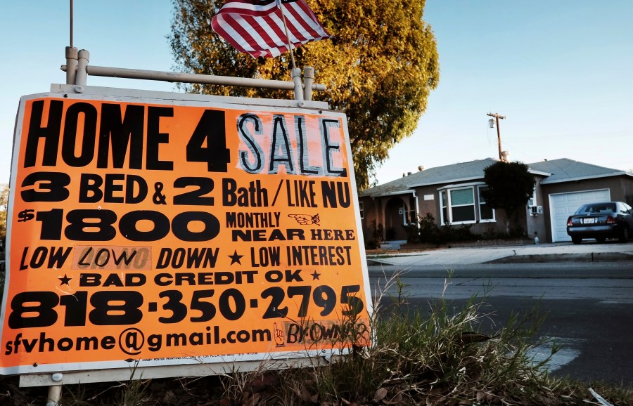 This Jan. 17, 2015, photo shows a sign advertising a house for sale in Los Angeles. (Richard Vogel / Associated Press)