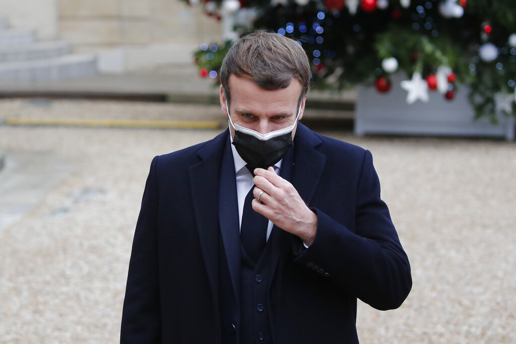 French President Emmanuel Macron reacts as he meets Portuguese Prime Minister Antonio Costa, Wednesday, Dec. 16, 2020 in Paris. (AP Photo/Francois Mori)