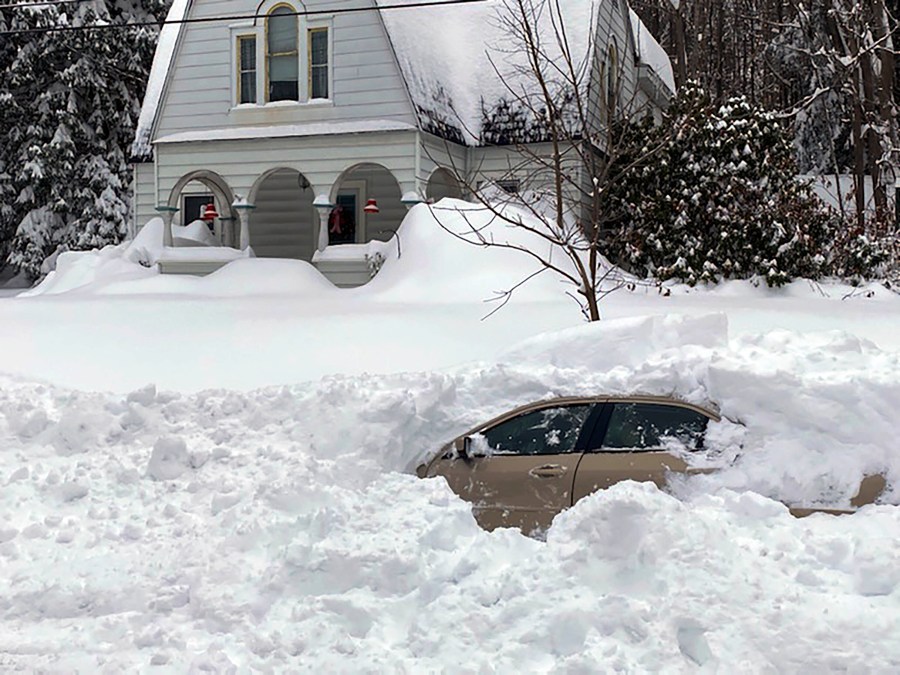 This photo, provided by the New York State Police, shows a car, in Oswego, NY, from which a New York State Police sergeant rescued Kevin Kresen, 58, of Candor, NY, stranded for 10 hours, covered by nearly 4 feet of snow thrown by a plow during this week's storm. (New York State Police via AP)