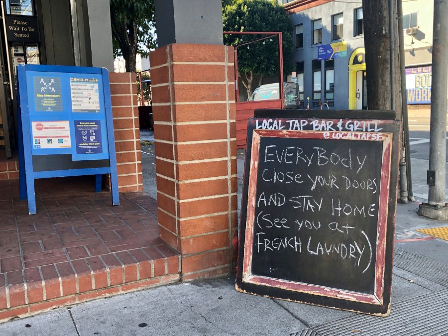 A sign calling out California Gov. Gavin Newsom for not following his own pandemic protocols at the French Laundry restaurant is seen in San Francisco on Dec. 8, 2020. (AP Photo/Juliet Williams)