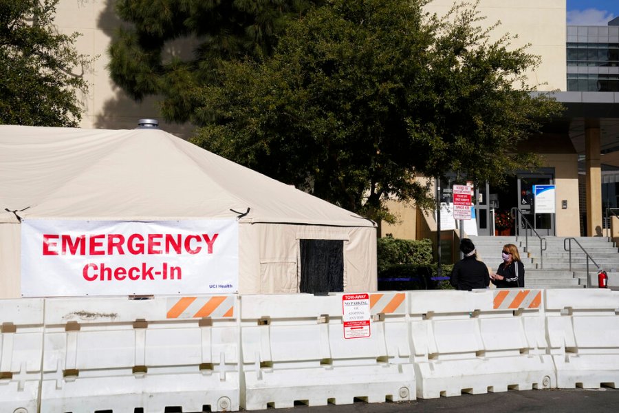 In this Dec. 17, 2020, file photo, medical tents are set up outside the emergency room at UCI Medical Center in Irvine, Calif. (AP Photo/Ashley Landis, File)