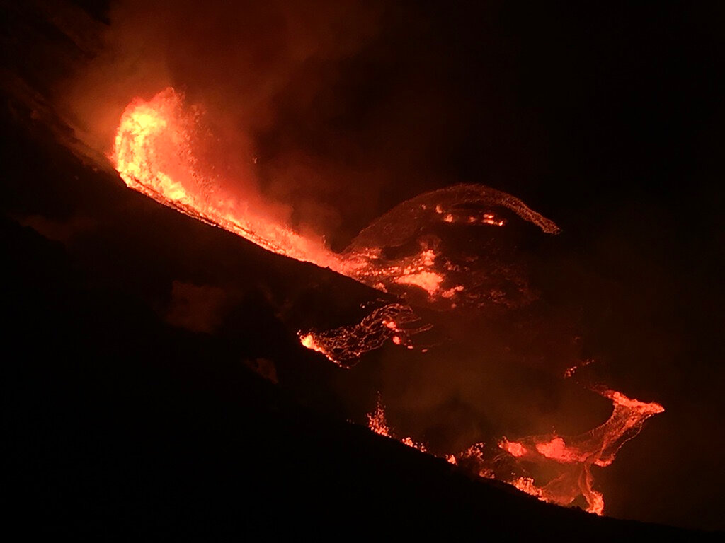 In this photo provided by the U.S. Geological Survey, lava flows within the Halema’uma’u crater of the Kilauea volcano Sunday, Dec. 20, 2020. (U.S. Geological Survey via AP)