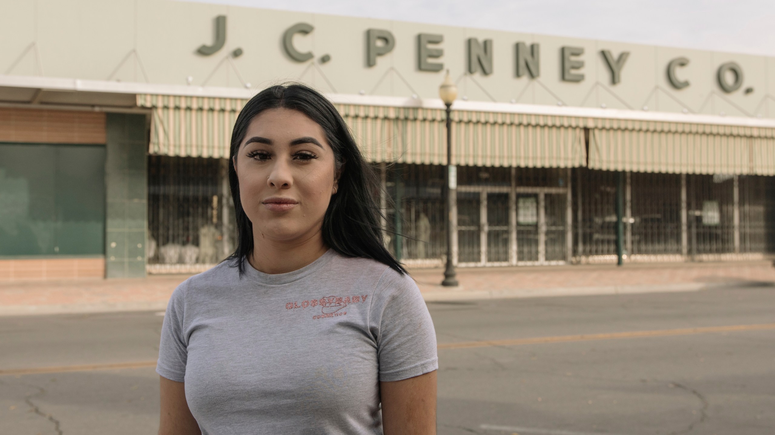 Alexandra Orozco stands for a portrait outside of the closed J.C. Penney where she was laid off from, in Delano, Calif., on Sunday, Dec. 6, 2020. (Madeline Tolle/The Fuller Project via AP)