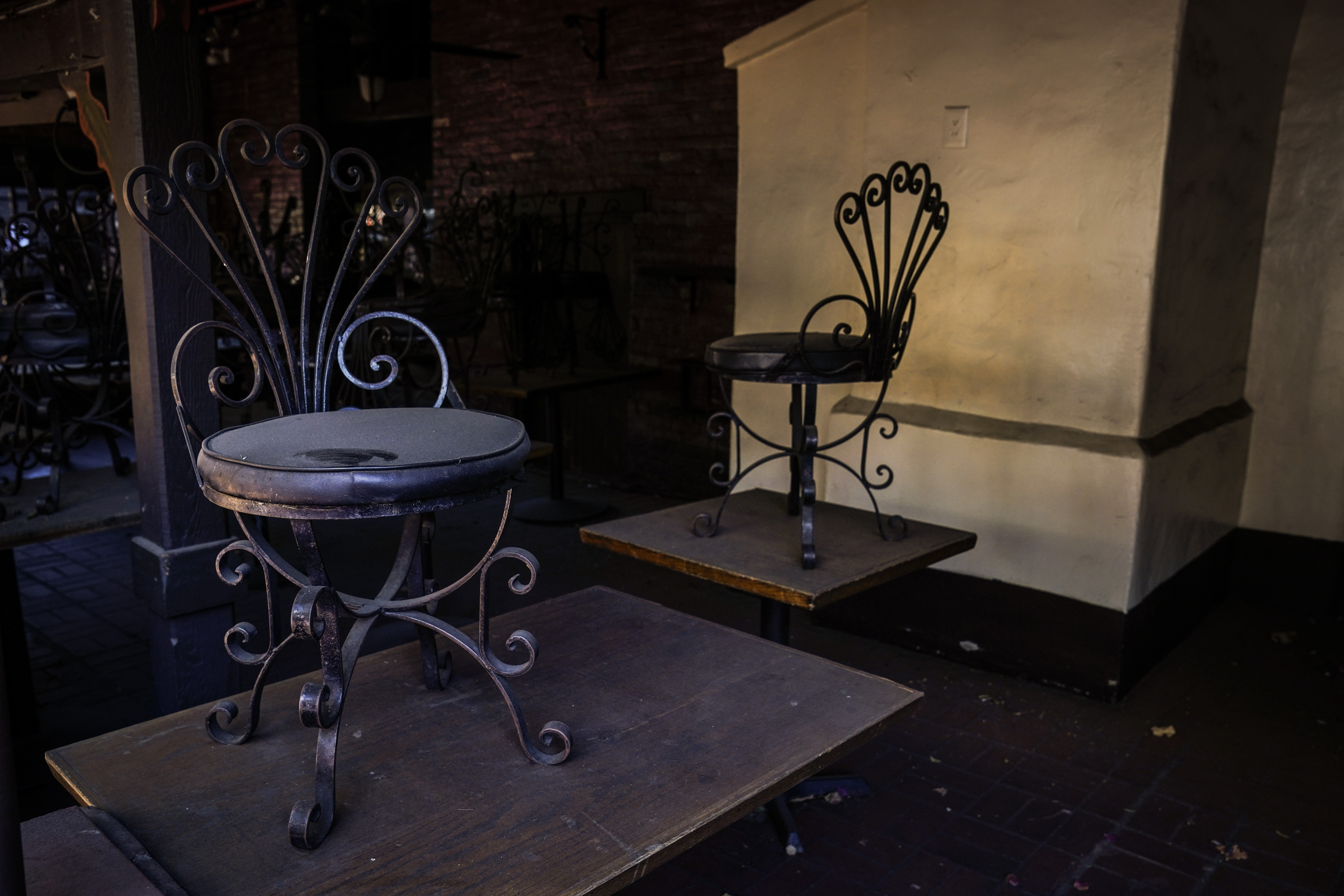 Dusty chairs are placed on top of dining tables in the patio area of a shuttered restaurant on Olvera Street in downtown Los Angeles, Tuesday, Dec. 15, 2020. Olvera Street, known as the birthplace of Los Angeles, has been particularly hard hit by the coronavirus pandemic, with shops and restaurants closed and others barely hanging on. (Jae C. Hong / Associated Press)