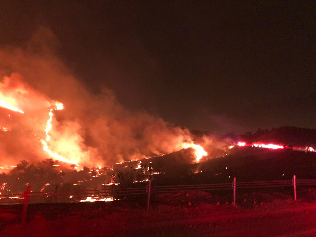 This photo provided by CAL FIRE San Diego shows a wildfire in northern San Diego County early Thursday, Dec. 24, 2020. (CAL FIRE San Diego via AP)