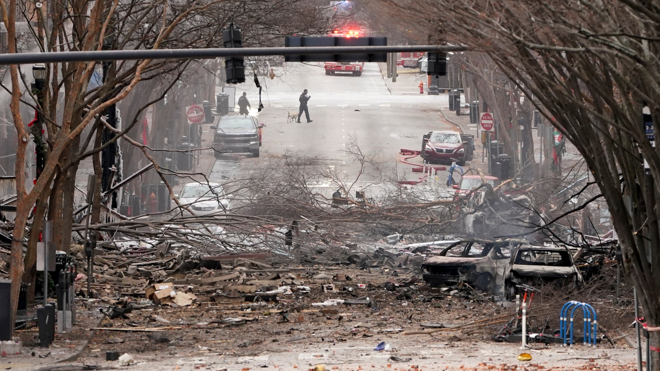 Emergency personnel work near the scene of an explosion in downtown Nashville, Tenn., Friday, Dec. 25, 2020. (AP Photo/Mark Humphrey)