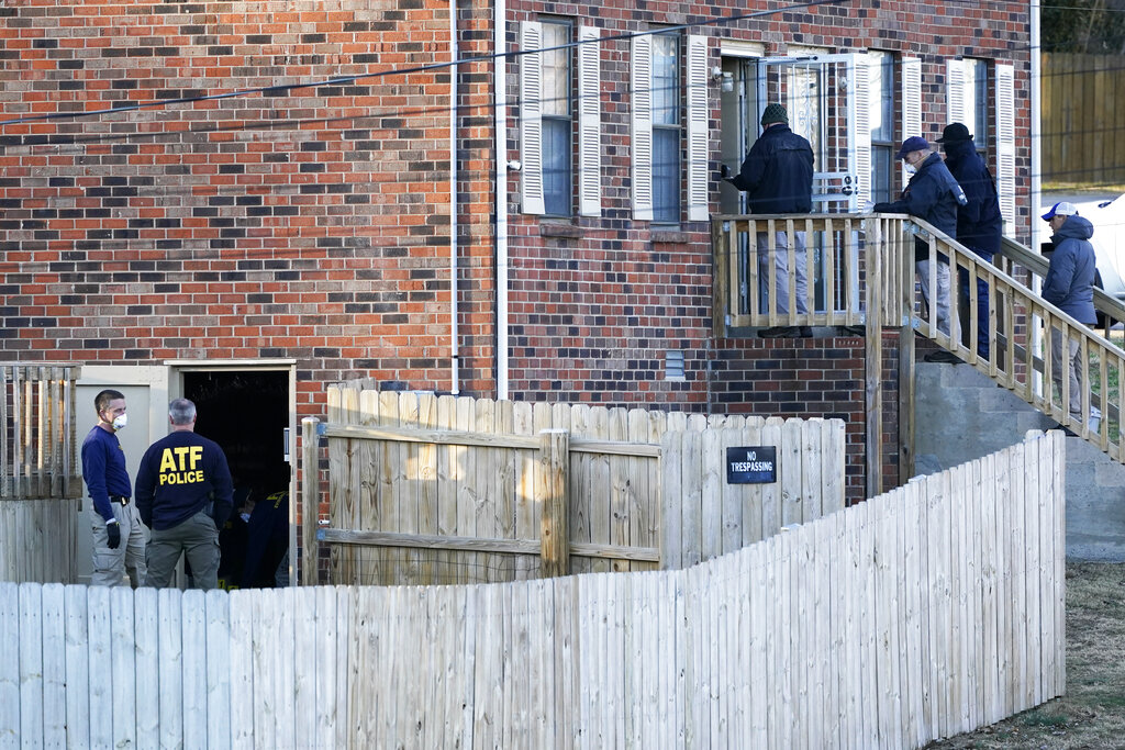 FBI and ATF agents investigate a home Saturday, Dec. 26, 2020, in Nashville, Tenn. (AP Photo/Mark Humphrey)