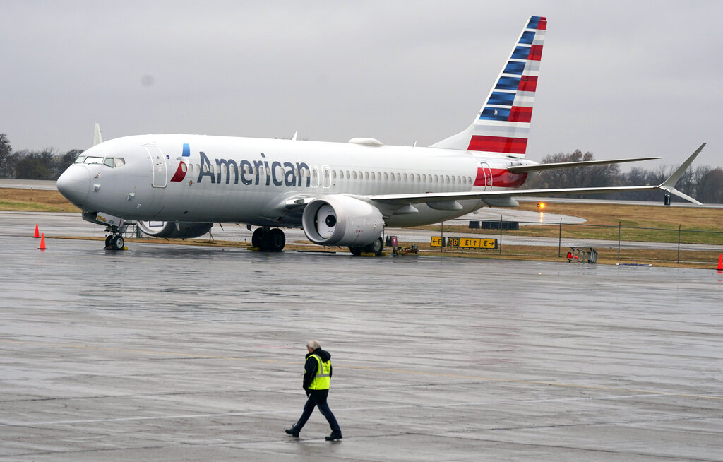 In this Dec. 2, 2020 file photo, an American Airlines Boeing 737 Max jet plane is parked at a maintenance facility in Tulsa, Okla. (AP Photo/LM Otero, File)