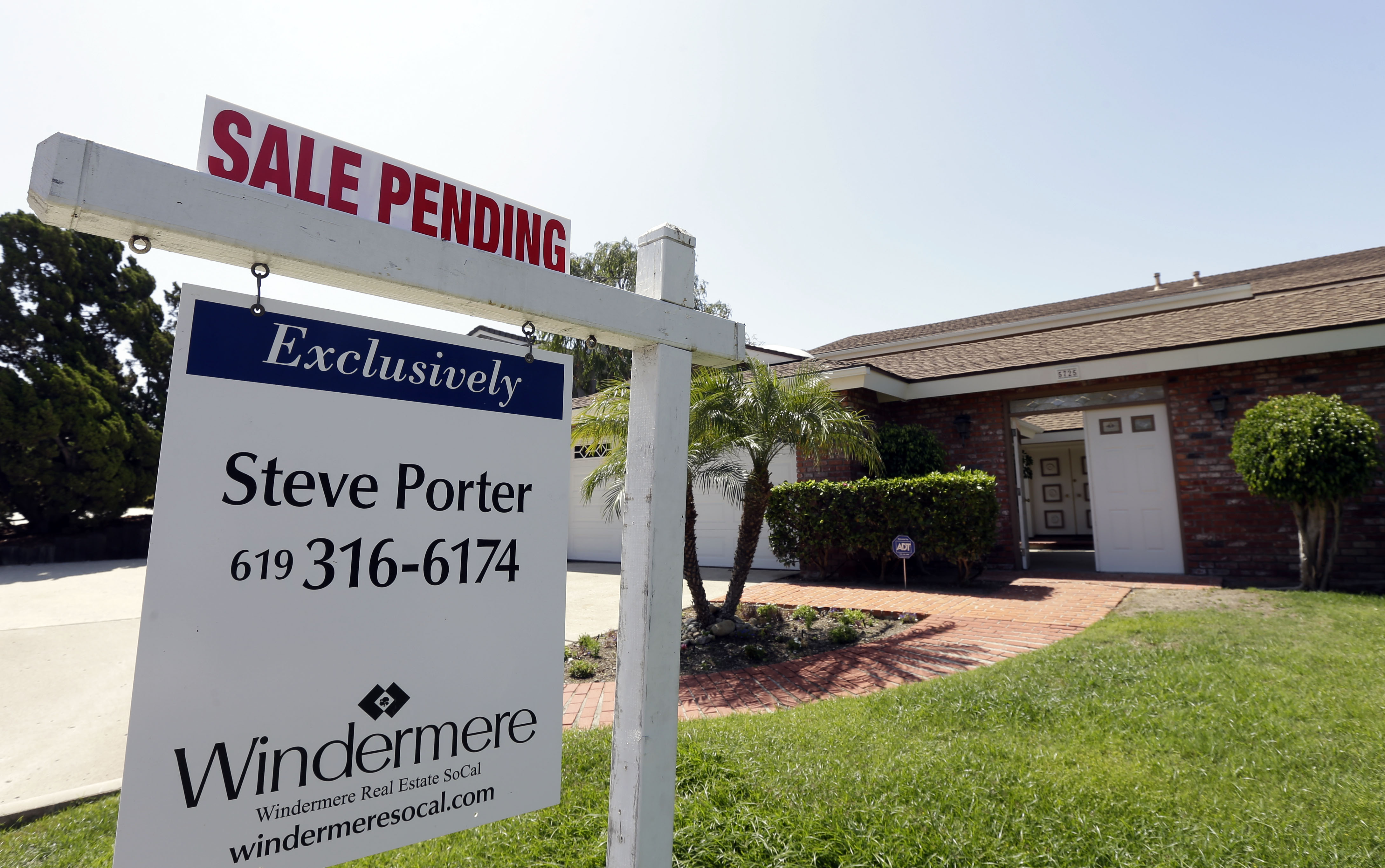 In this Wednesday, Aug. 14, 2013, file photo, a home is for sale in San Diego. (AP Photo/Gregory Bull, File)