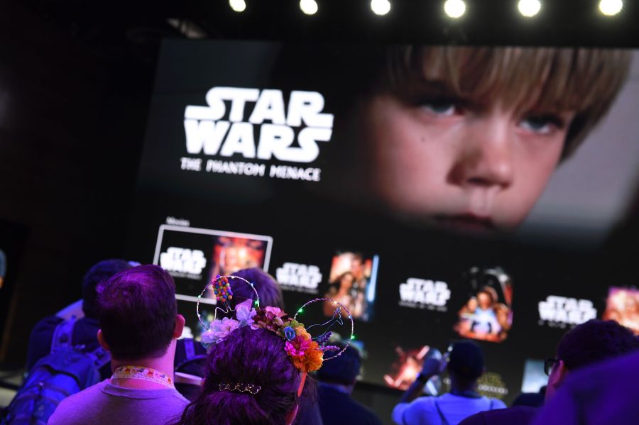 Attendees get a preview of the Disney+ streaming service interface at the D23 Expo on Aug.23, 2019 at the Anaheim Convention Center. (ROBYN BECK/AFP via Getty Images)