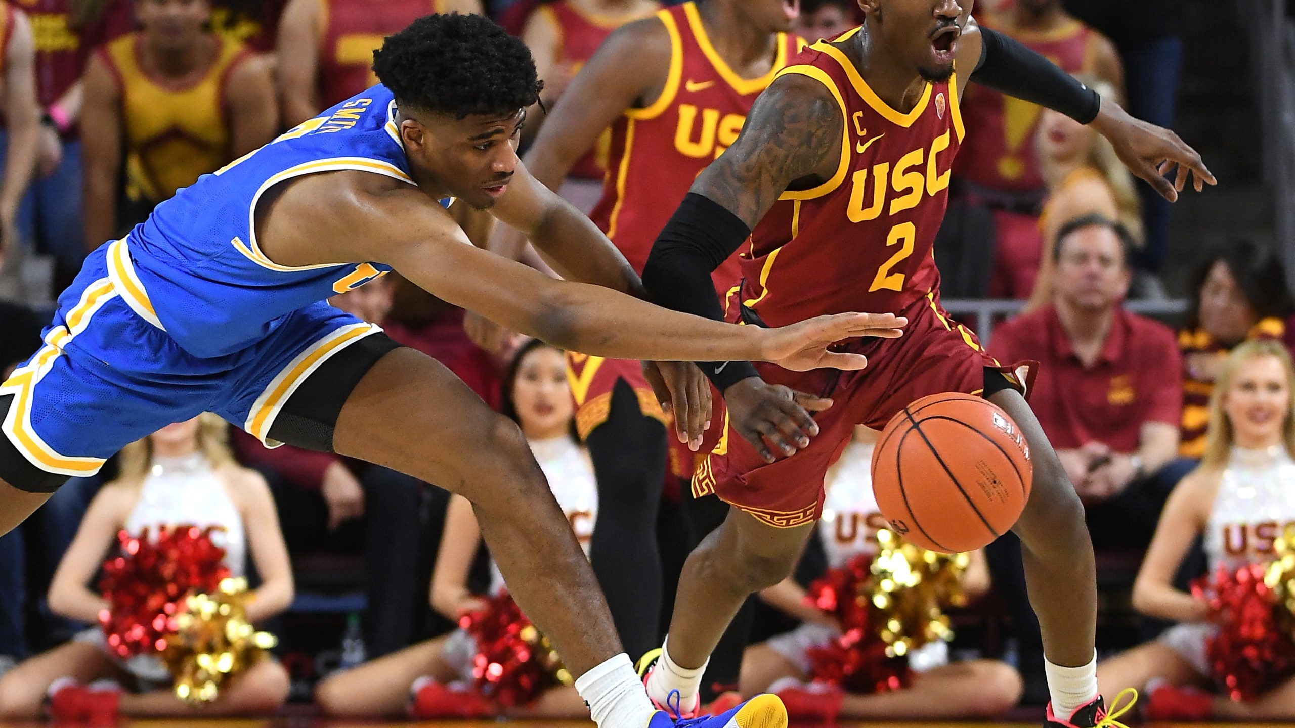 Chris Smith #5 of the UCLA Bruins and Jonah Mathews #2 of the USC Trojans battle for a loose ball in the second half of the game at Galen Center on March 7, 2020 in Los Angeles, California. (Jayne Kamin-Oncea/Getty Images)