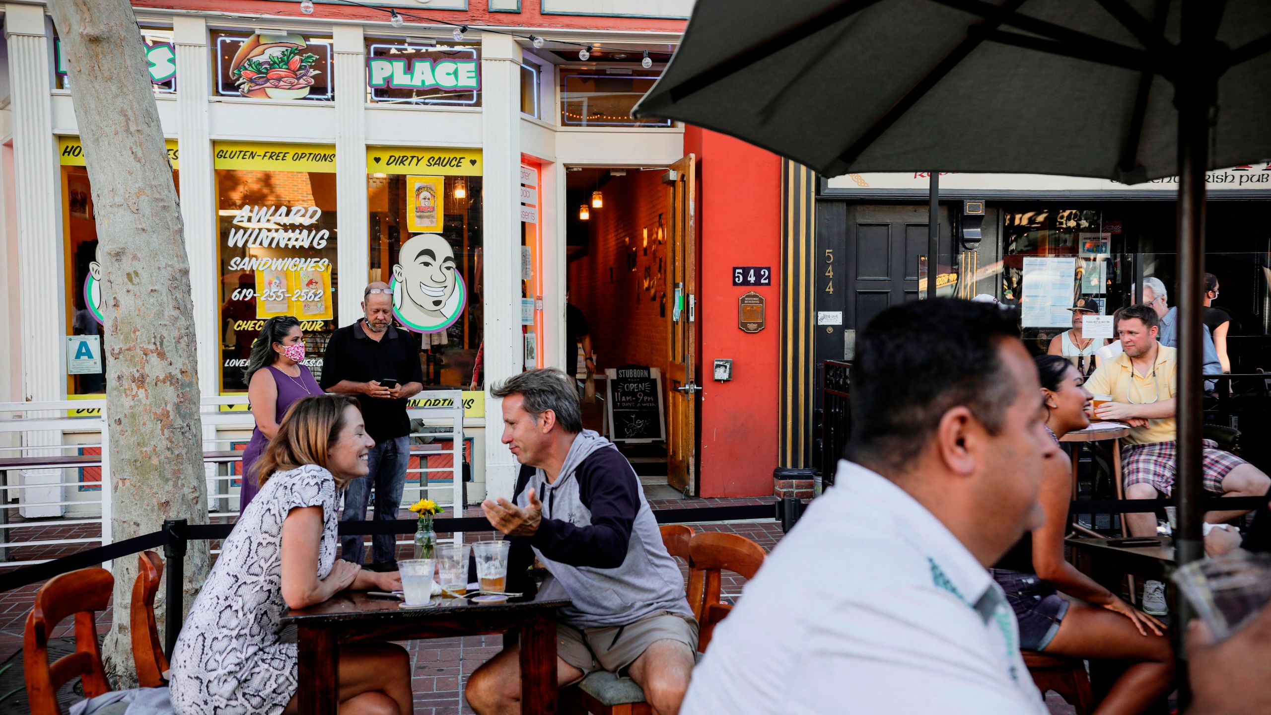 Patrons dine at an outdoor restaurant along 5th Avenue in The Gaslamp Quarter in downtown San Diego, California on, July 17, 2020. (Sandy Huffaker/AFP via Getty Images)