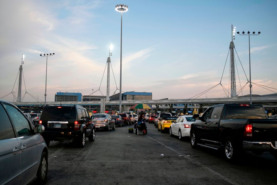 Cars line up to cross the U.S./Mexico border to San Diego at San Ysidro port of entry, in Tijuana, Baja California state, Mexico, on Oct. 6, 2020. (GUILLERMO ARIAS/AFP via Getty Images)