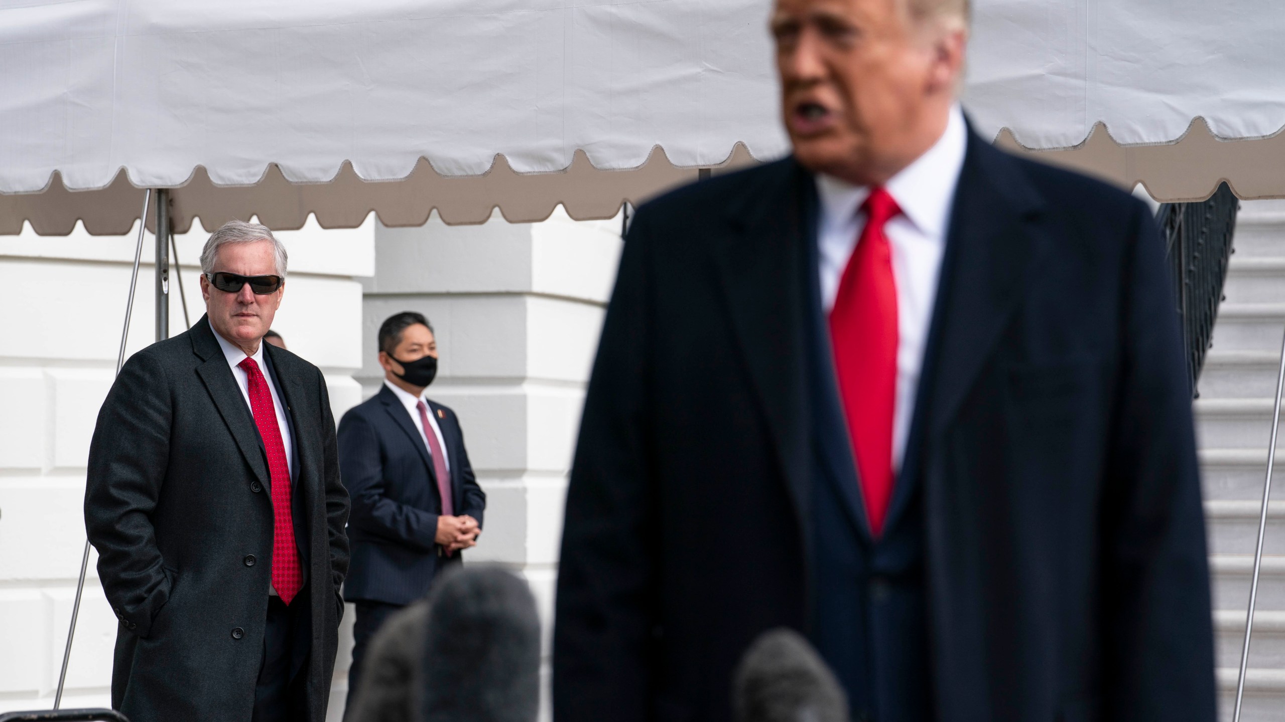 White House Chief of Staff Mark Meadows listens as President Donald Trump speaks to the press outside the White House on Oct. 30, 2020. (Sarah Silbiger/Getty Images)