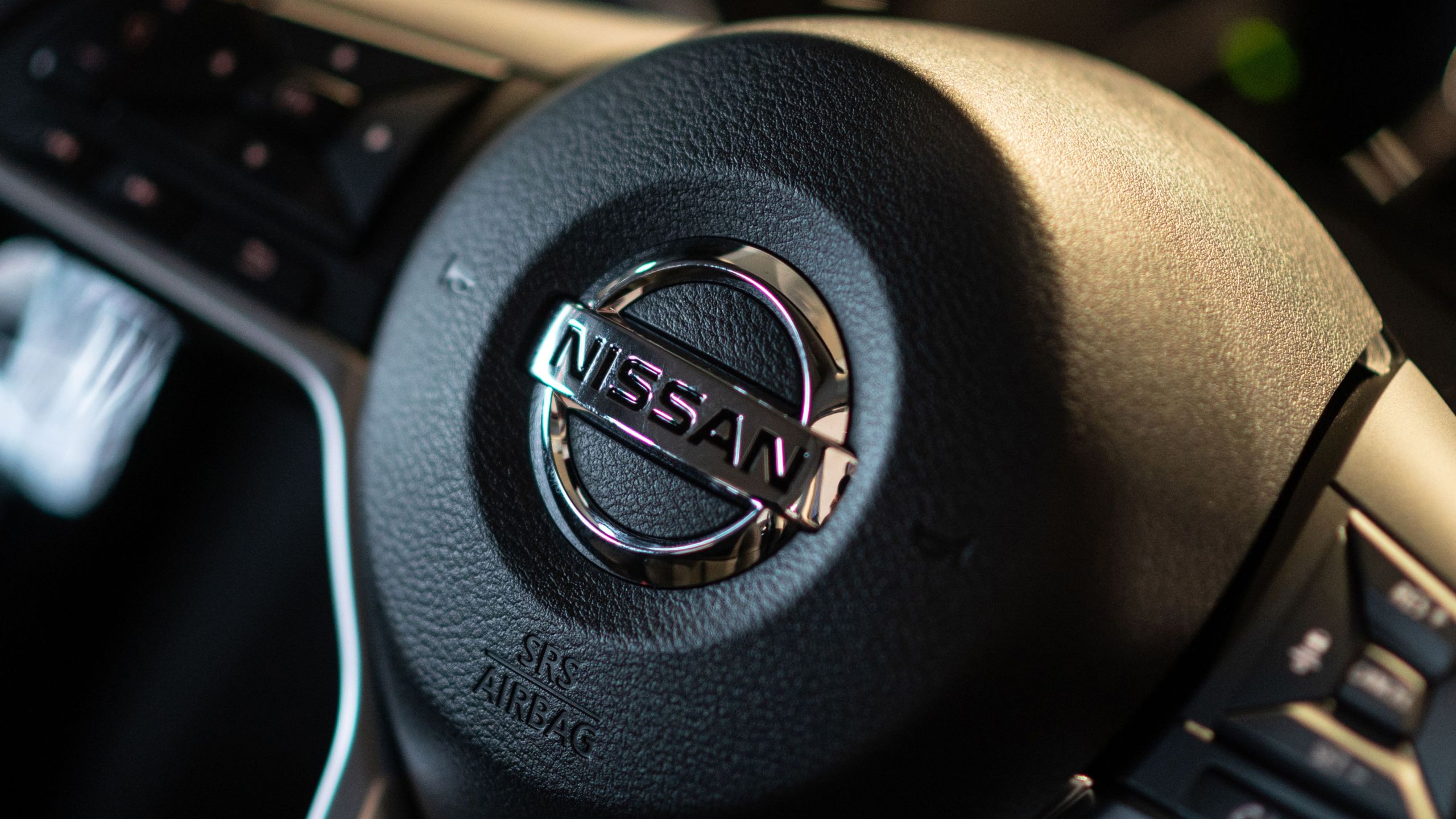 The Nissan logo is seen on a car at the showroom at the company's global headquarters in Yokohama, Kanagawa prefecture on November 12, 2020. (Philip Fong/AFP via Getty Images)