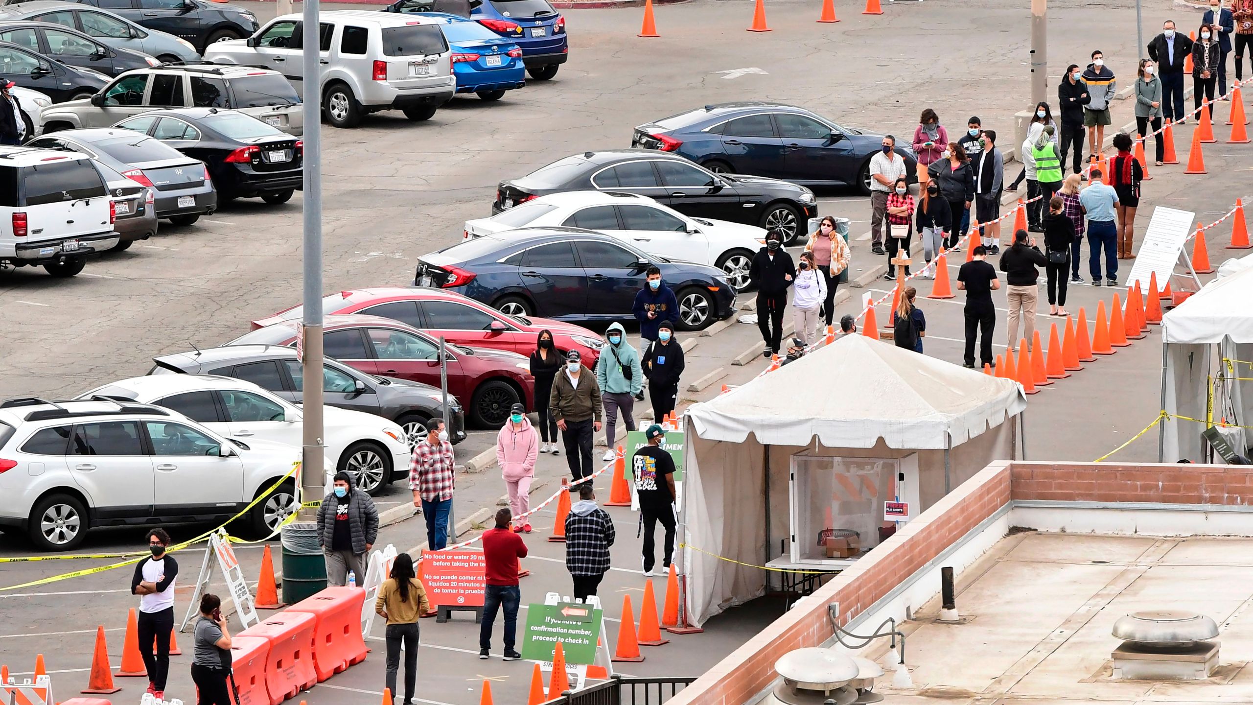 People wait in line at a coronavirus testing center in Los Angeles on Dec. 8, 2020. (FREDERIC J. BROWN/AFP via Getty Images)