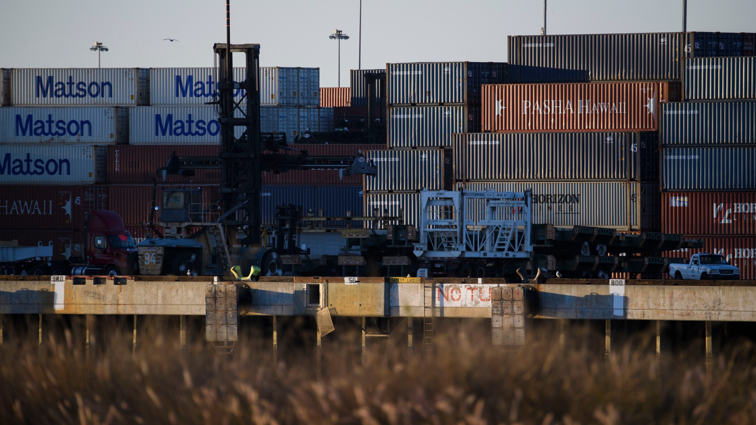 Cargo shipping containers in the Port of Long Beach on December 14, 2020 in Long Beach, California. - The bridge's higher clearance accommodates larger cargo ships, linking the international and domestic shipping of goods and materials at the port complex. (Patrick T. Fallon/AFP via Getty Images)