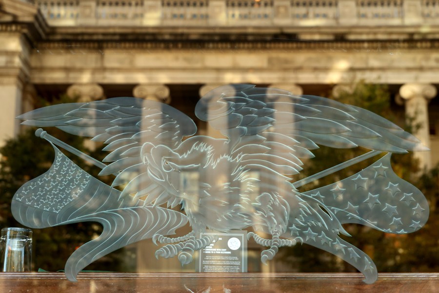 The U.S. Treasury Department is reflected in a restaurant window less than 24 hours before Election Day, on Nov. 2, 2020, in Washington, DC. (Chip Somodevilla/Getty Images)