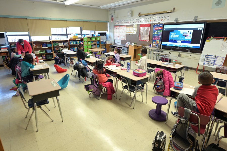 Jackie Sato (L), a teacher at Yung Wing School P.S. 124 teaches blended learning students during the first day back to school on Dec. 7, 2020 at Yung Wing School P.S. 124 in New York City. Students whose parents opted for blended learning returned to school today after all were shut down on Nov. 18, when New York City had reached a citywide positivity rate of three percent of all coronavirus tests performed over a seven-day period. (Photo by Michael Loccisano/Getty Images)