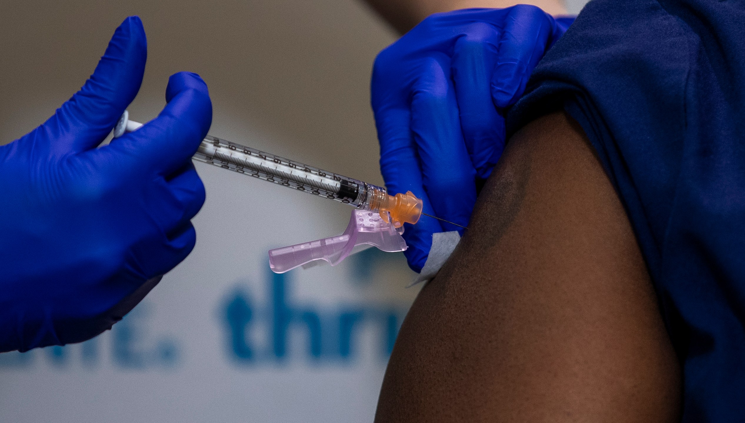 A nurse administers the Pfizer-BioNTech COVID-to another nurse during a vaccine event at Kaiser Permanente Capitol Hill Dec.17, 2020 in Washington, DC. (Shawn Thew-Pool/Getty Images)