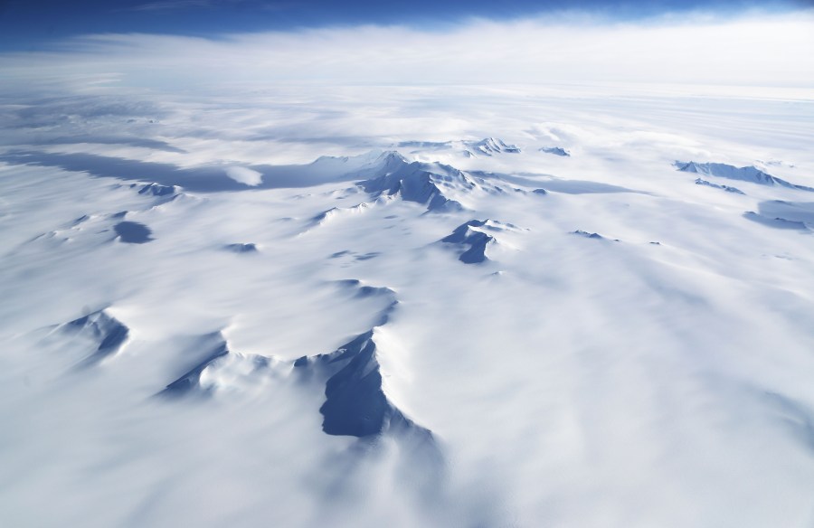 Mountains and land ice are seen from NASA's Operation IceBridge research aircraft in the Antarctic Peninsula region, on November 4, 2017, above Antarctica. (Mario Tama/Getty Images)