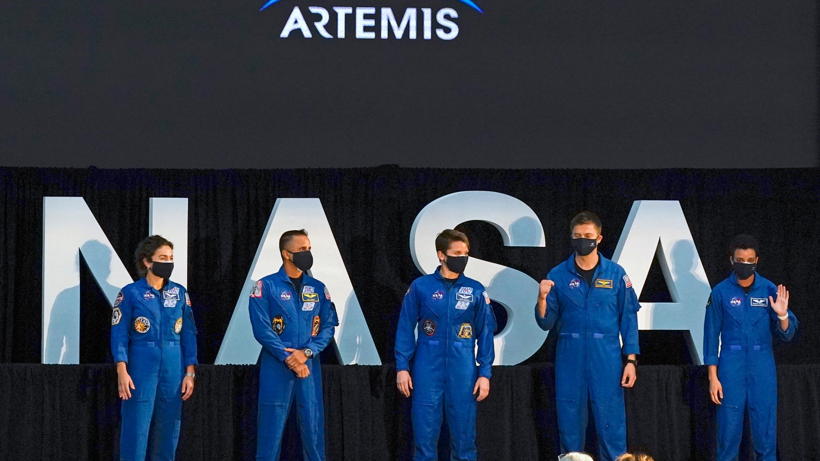 Five of the astronauts that will be part of the Atremis missions, from left, Jessica Meir, Joe Acaba, Anne McClain, Matthew Dominick, and Jessica Watkins are introduced by Vice President Mike Pence during the eighth meeting of the National Space Council at the Kennedy Space Center Wednesday, Dec. 9, 2020, in Cape Canaveral , Fla. (AP Photo/John Raoux)