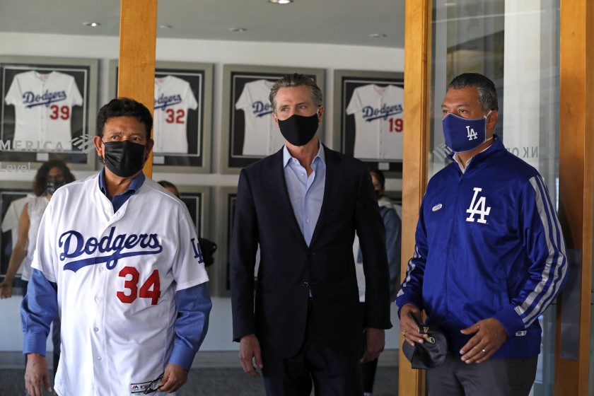 Gov. Gavin Newsom, center, visits Dodger Stadium with former Dodger pitcher Fernando Valenzuela, left, and California Secretary of State Alex Padilla shortly before the November election. Padilla is considered one of the favorites to be appointed to the U.S. Senate to fill a vacancy created when Sen. Kamala Harris is sworn in as vice president.(Carolyn Cole / Los Angeles Times)