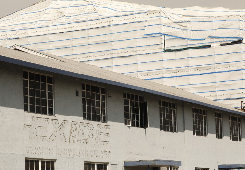 Portions of the former Exide Technologies lead-acid battery recycling plant in Vernon, seen in October, are wrapped in plastic to prevent the release of lead and other contaminants. (Al Seib/Los Angeles Times)