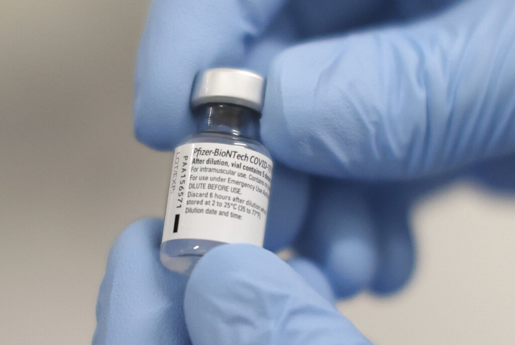 A vial of the Pfizer-BioNTech COVID-19 vaccine is seen at the Royal Victoria Hospital in Belfast on Dec. 8, 2020. (Liam McBurney/Pool via AP)