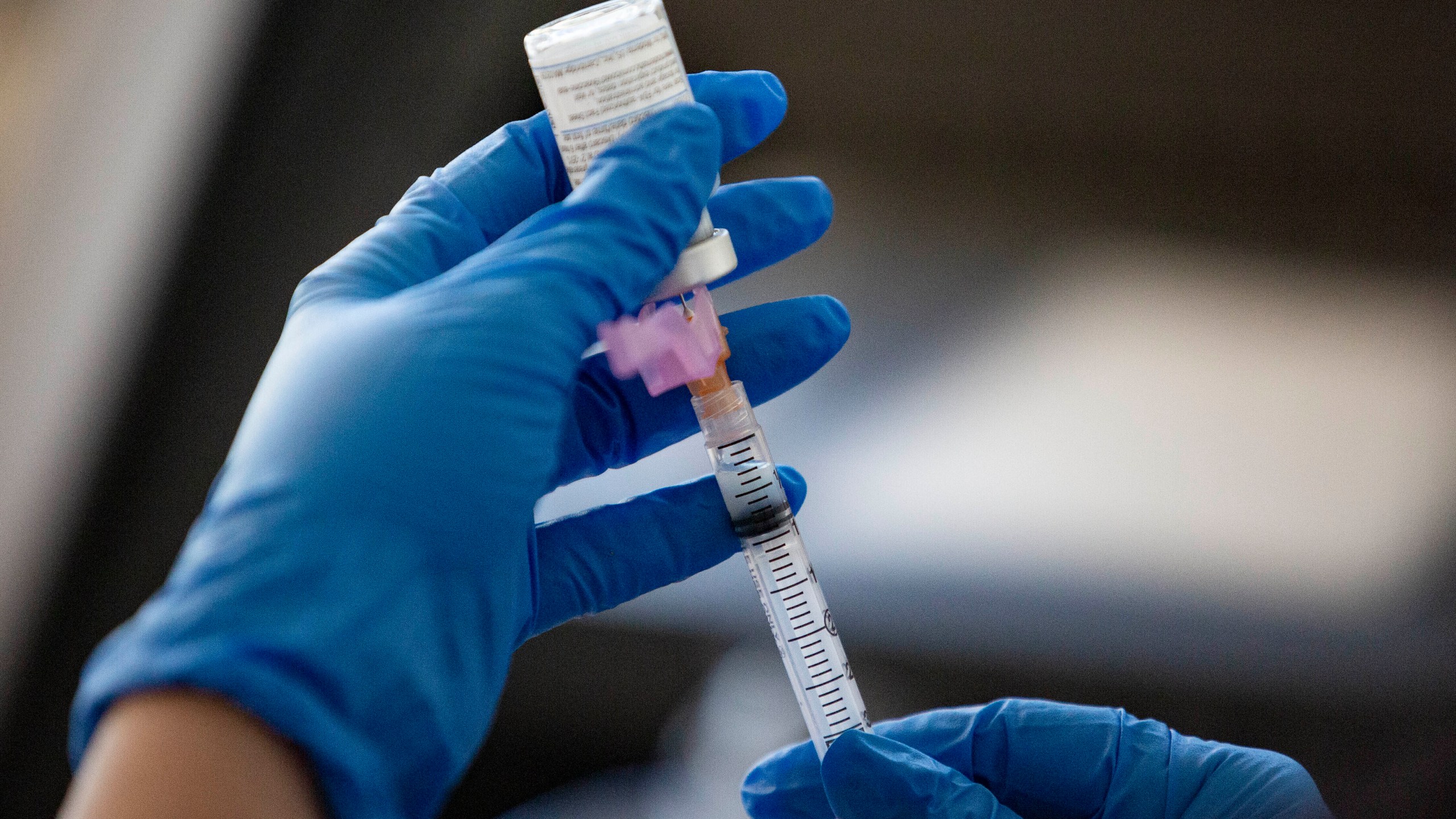 A file photo shows a nurse extracting a dose of the Moderna COVID-19 on Jan. 4, 2021, in Odessa, Texas. (Jacob Ford/Odessa American via AP)