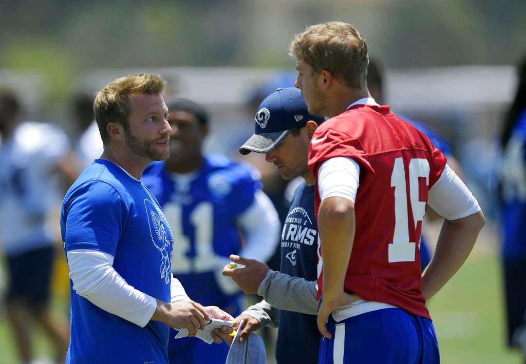 Los Angeles Rams head coach Sean McVay, left, talks with quarterback Jared Goff, right, as offensive coordinator Matt LaFleur stands between them during NFL football practice, Monday, June 5, 2017, in Thousand Oaks, Calif. (AP Photo/Mark J. Terrill)