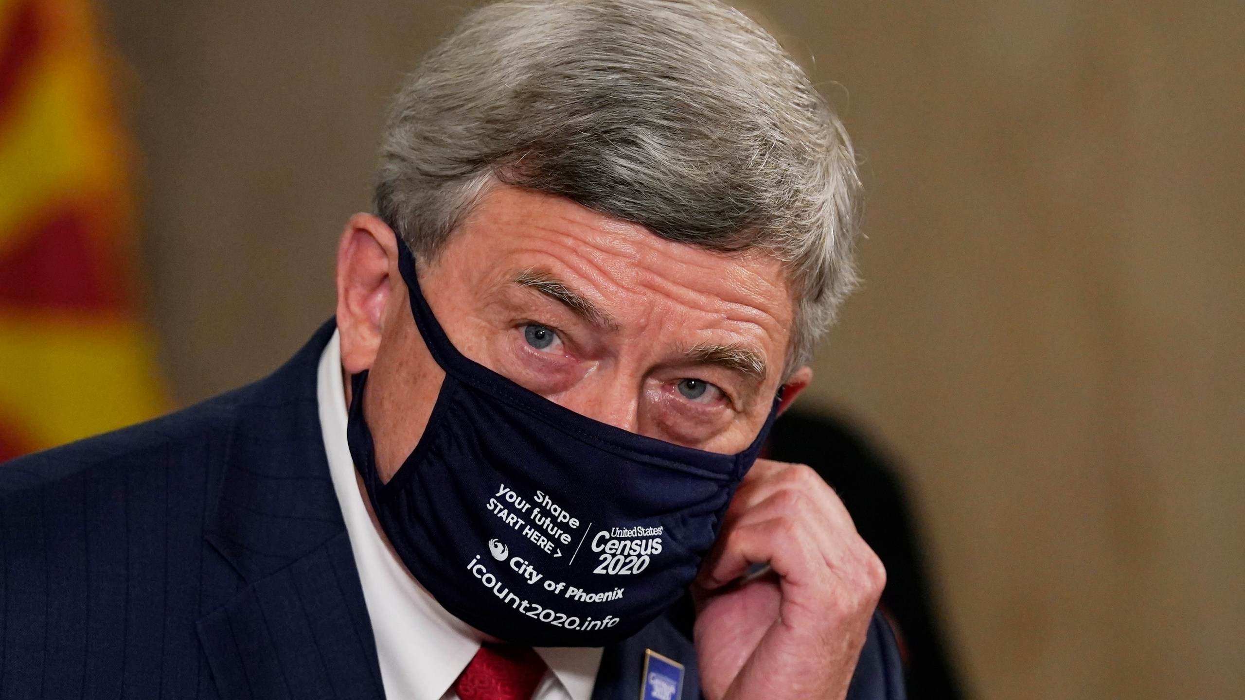 U.S. Census Director Steven Dillingham pauses as he listens to a question at a census news conference to urge Arizonans to participate in the nation's once-a-decade census population count Thursday, Sept. 17, 2020, in Phoenix. (AP Photo/Ross D. Franklin, Pool)