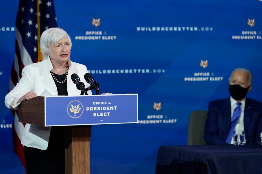 President-elect Joe Biden, right, listens as Janet Yellen, who Biden nominated to serve as Secretary of the Treasury, speaks at The Queen theater, Tuesday, Dec. 1, 2020, in Wilmington, Del. (AP Photo/Andrew Harnik)