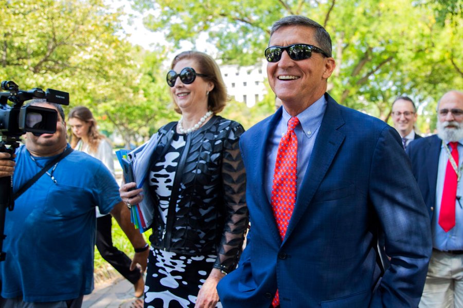 In this Sept. 10, 2019, file photo, Michael Flynn, President Donald Trump's former national security adviser from Middletown, R.I., leaves federal court with his lawyer Sidney Powell, left, following a status conference in Washington. (Manuel Balce Ceneta/ Associated Press File)