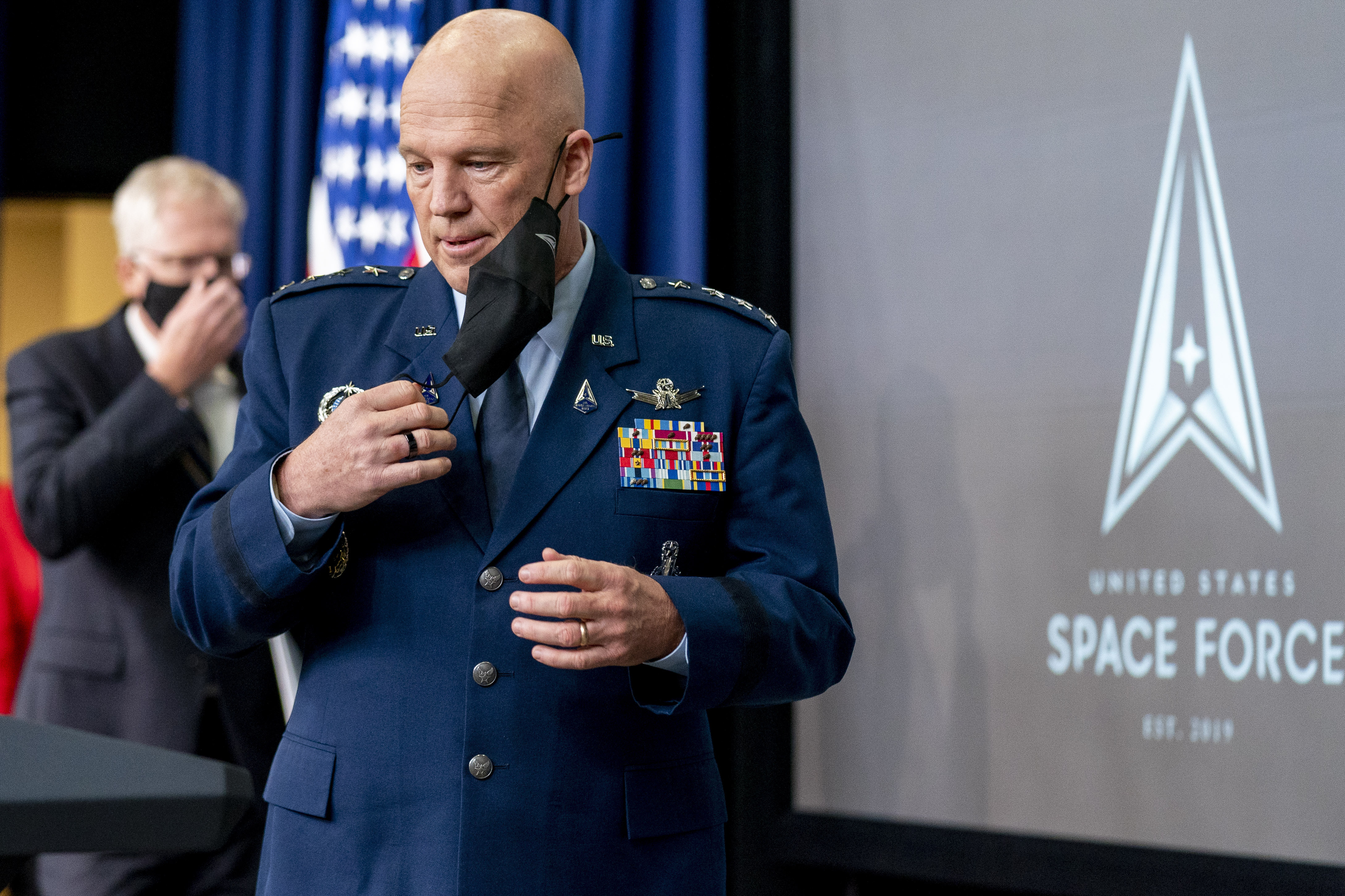 Chief of Space Operations at U.S. Space Force Gen. John Raymond takes the podium to speak at a ceremony to commemorate the first birthday of the U.S. Space Force at the Eisenhower Executive Office Building on the White House complex​, Friday, Dec. 18, 2020, in Washington. (AP Photo/Andrew Harnik)