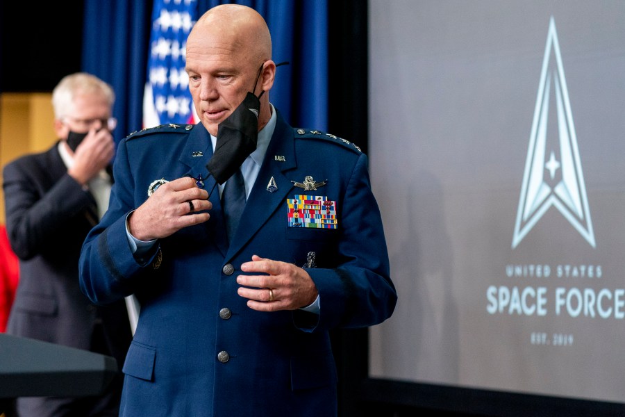 Chief of Space Operations at U.S. Space Force Gen. John Raymond takes the podium to speak at a ceremony to commemorate the first birthday of the U.S. Space Force at the Eisenhower Executive Office Building on the White House complex​, Friday, Dec. 18, 2020, in Washington. (AP Photo/Andrew Harnik)