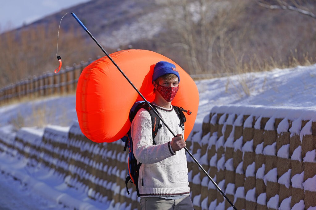 Cameron French, from White Pine Touring, wears an Ascent 40 AVABAG avalanche backpack on Dec. 18, 2020, in Park City, Utah. (AP Photo/Rick Bowmer)