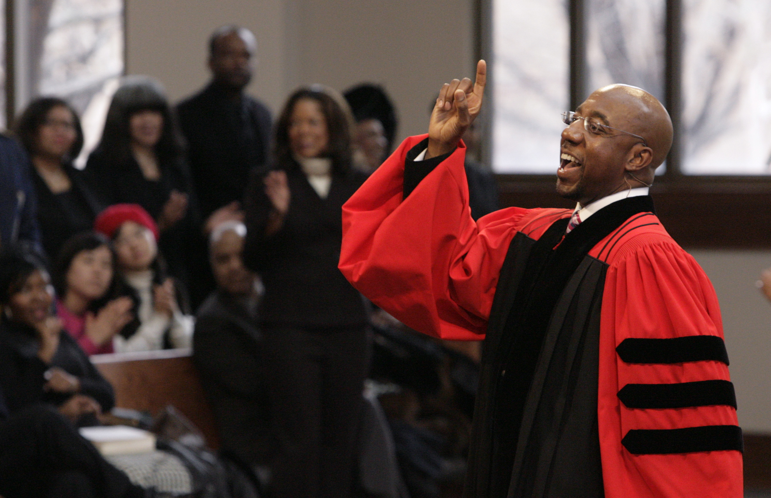 In this Sunday Jan. 18, 2009 file photo, Rev. Raphael Warnock delivers a sermon during a church service at Ebenezer Baptist Church in Atlanta. (AP Photo/John Amis)