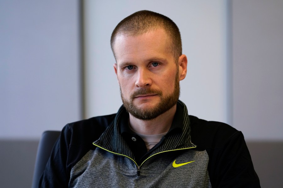 In this Dec. 31, 2020, file photo pardoned Blackwater contractor Evan Liberty poses for a photo in Washington. Liberty is one of four former Blackwater contractors pardoned by President Donald Trump in one of his final acts in office, wiping away their convictions in a 2007 shooting rampage in Baghdad that killed more than a dozen Iraqi civilians. The pardons were met with intense condemnation both in the United States and the Middle East. (AP Photo/Susan Walsh)